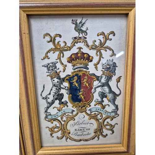 56 - Four 19th century coloured engraving family crests. Fitted within matching frames [22.5x16.5cm]