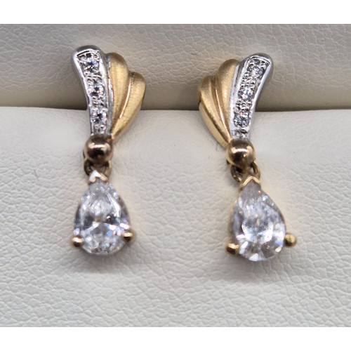 33 - 18ct yellow and white gold ring, earrings, bracelet and necklace set. 
Ring- Cubic Zirconia- 18ct ye... 