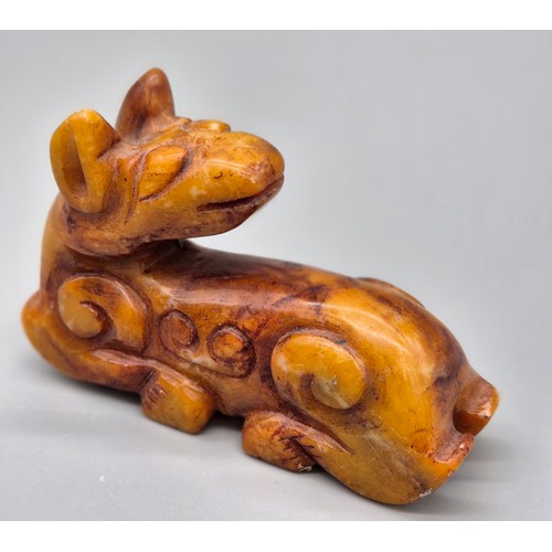 52 - Chinese hardstone hand carved sculpture of a dragon dog. [7.5cm length]