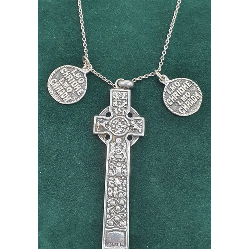 6 - Alexander Ritchie of Iona Celtic cross design pendant and two small Iona circular silver pendants. A... 