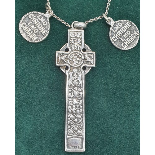 6 - Alexander Ritchie of Iona Celtic cross design pendant and two small Iona circular silver pendants. A... 