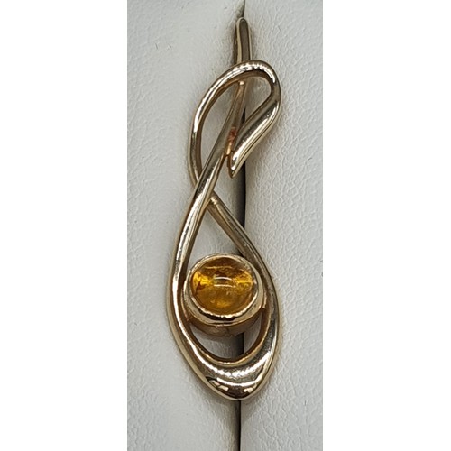 14 - Ortak Silversmith 9ct yellow gold and amber pendant. [3.55grams] [4cm length]