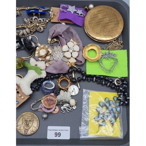 99 - A Tray of costume jewellery; art deco compact, various murano rings and other collectables