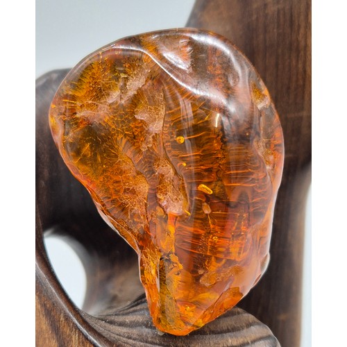 102 - Alberta Žulkus
Original Elliptical wood with amber in the centre of the sculpture. Stamped to the ba... 