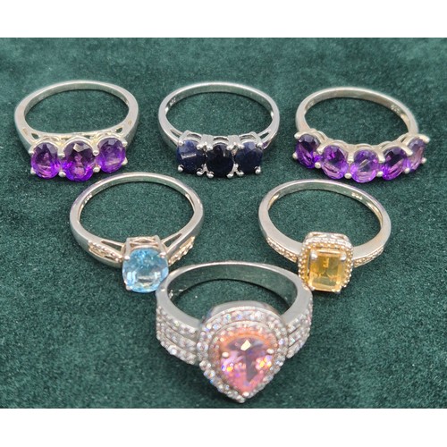 68 - A Lot of six 925 silver and gem stone set rings.