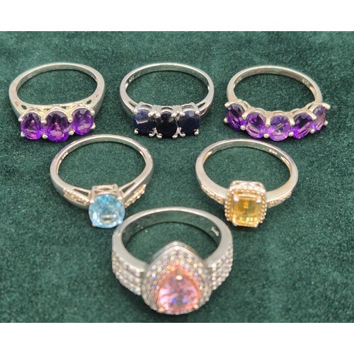 68 - A Lot of six 925 silver and gem stone set rings.
