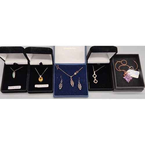 73 - A Collection of Silver chains and gem stone pendants; Emerald and diamond stone pendant, Citrine gem... 