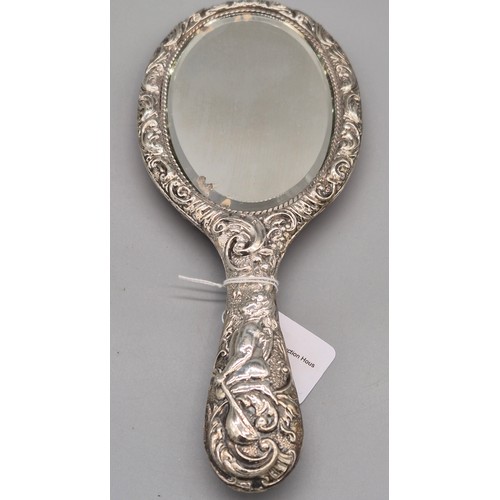 22 - Birmingham silver raised relief hand mirror, detailing cherub figures and scroll effect. [27cm lengt... 