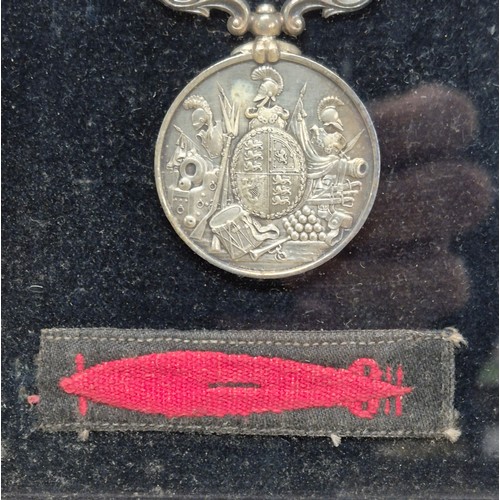 50 - Three Framed WWI Medals and Torpedo Badge belonging to James J. Michie. War Medal, Long Service meda... 