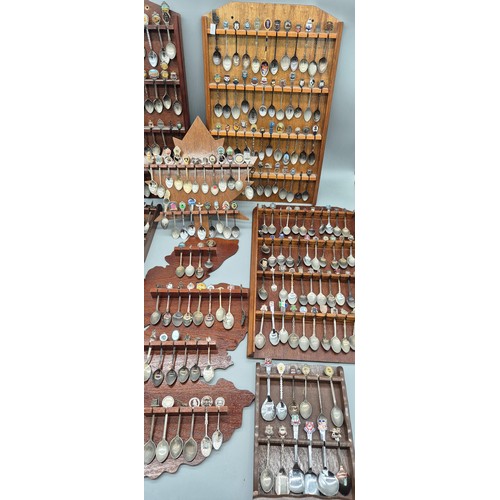 254 - A Large Collection of Souvenir Spoon racks and spoons.