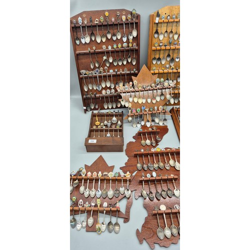 254 - A Large Collection of Souvenir Spoon racks and spoons.