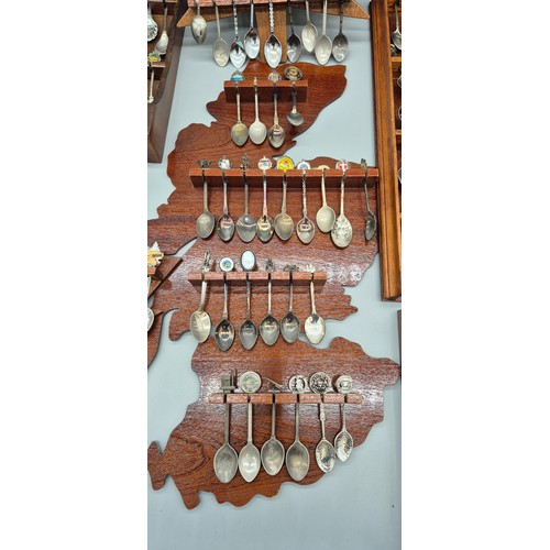 254 - A Large Collection of Souvenir Spoon racks and spoons.