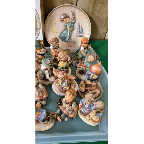 351 - A Large Collection of Goebel Hummel pottery figurines & collector plate boxed. [As found]