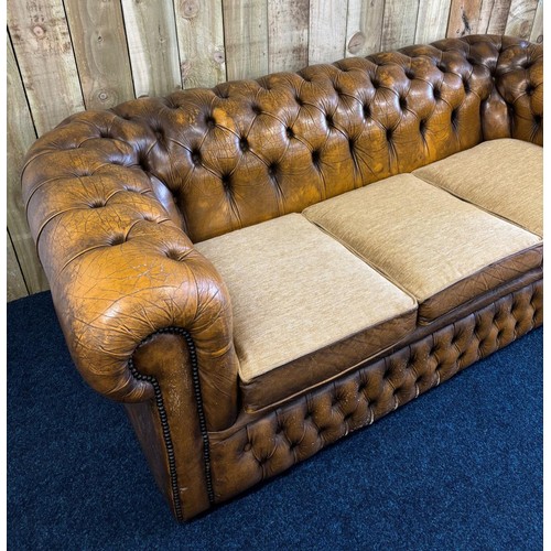 236 - Chesterfield three seat sofa, mustard leather fitted with three neutral material cushions. [70x195x8... 