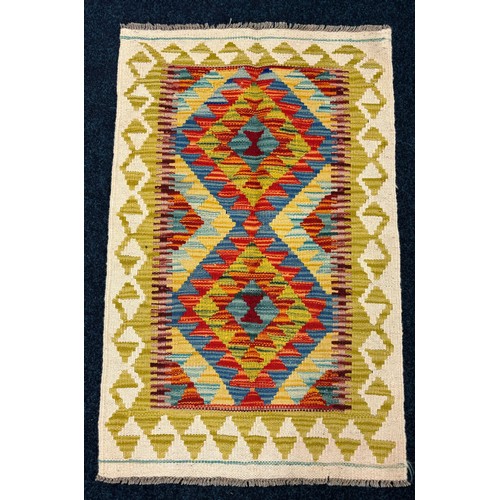 291 - Small Hand Knotted Chobi Kilim rug. {90x58cm}