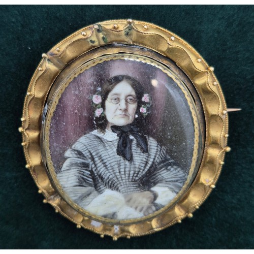 29 - 19th century Mourning brooch, swivel section is plated and having a hand painted portrait of an elde... 