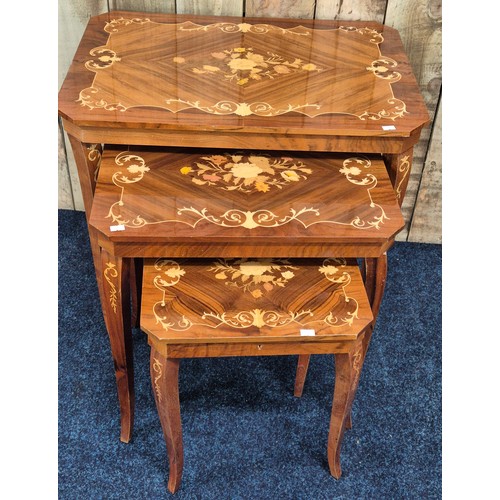 325 - A Nest of three Italian marquetry style tables. [Smallest having music box]
[62x65x45cm- large table... 