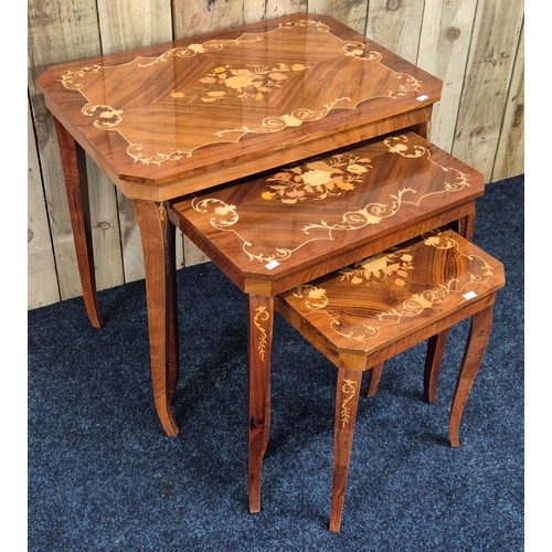 325 - A Nest of three Italian marquetry style tables. [Smallest having music box]
[62x65x45cm- large table... 