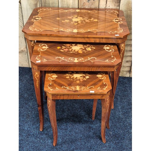 325 - A Nest of three Italian marquetry style tables. [Smallest having music box]
[62x65x45cm- large table... 