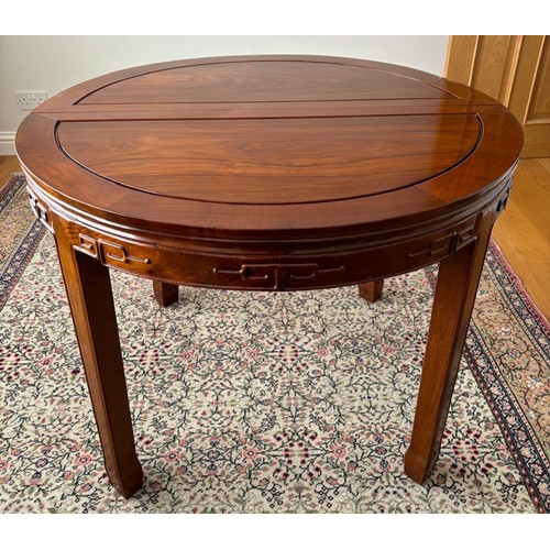 280 - Chinese rosewood dining table and four matching dining chairs. Glass protective top. Folds into a ci... 