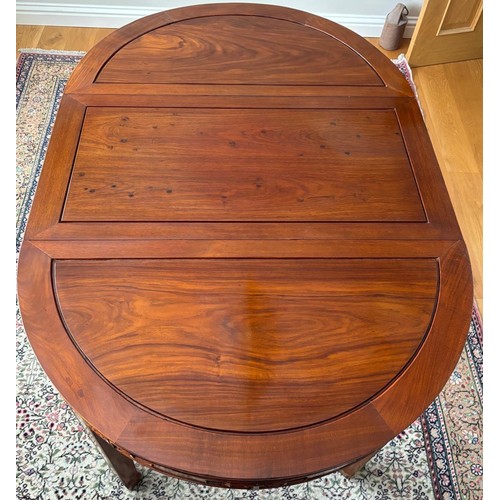 280 - Chinese rosewood dining table and four matching dining chairs. Glass protective top. Folds into a ci... 