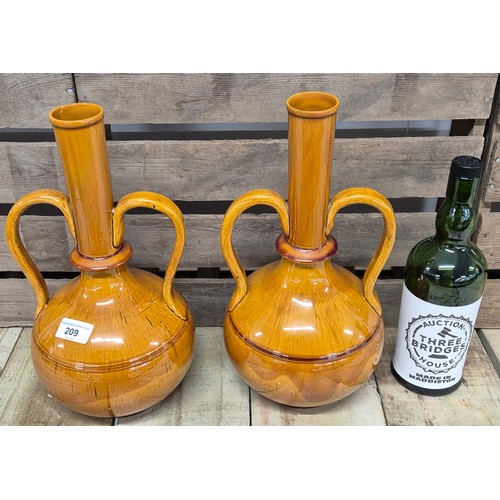 209 - A Pair of Dunmore pottery double handle bottle neck vases. Impressed stamp 