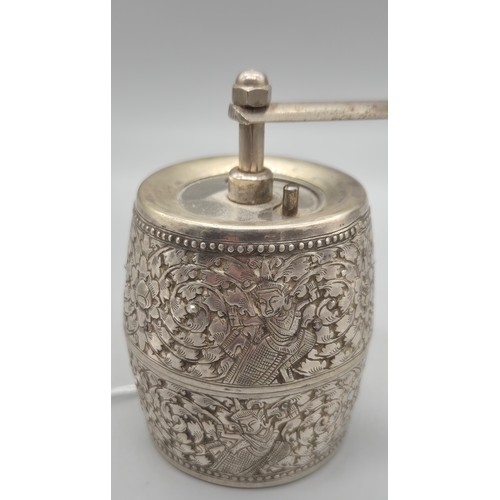 69 - White metal Pepper Mill Grinder. Designed with raised relief Indian buddha figures.