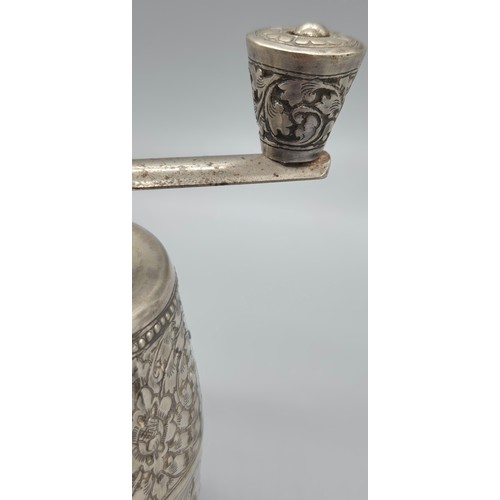 69 - White metal Pepper Mill Grinder. Designed with raised relief Indian buddha figures.