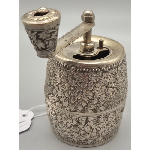 69 - White metal Pepper Mill Grinder. Designed with raised relief Indian buddha figures.