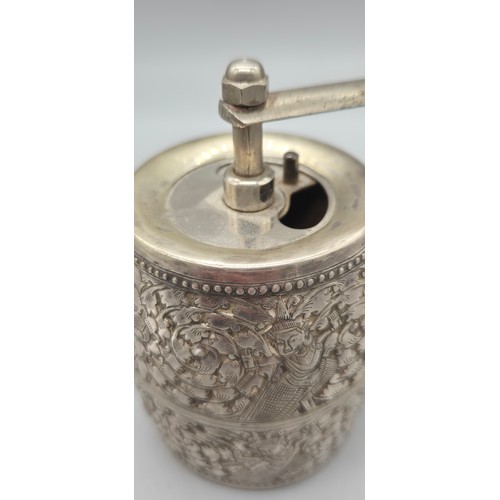 69 - White metal Pepper Mill Grinder. Designed with raised relief Indian buddha figures.