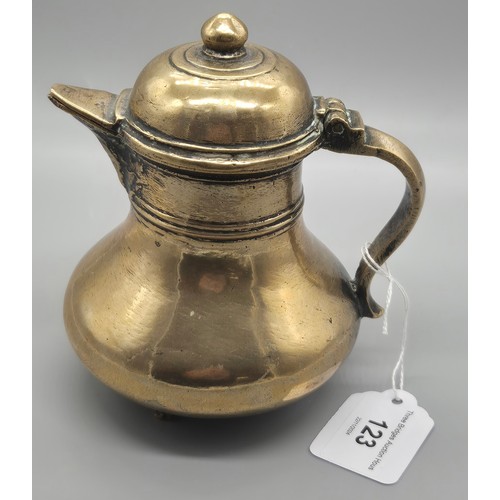 123 - Two pieces of Indian brass and Bronze wares; Bronze Four foot coffee pot and Brass Urn fitted with v... 