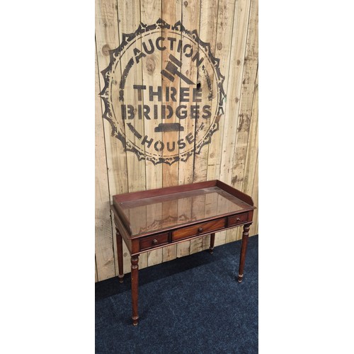 298 - 19th century Mahogany three drawer console table on turned support [86x106x53cm]