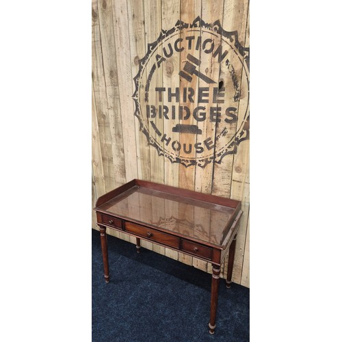 298 - 19th century Mahogany three drawer console table on turned support [86x106x53cm]