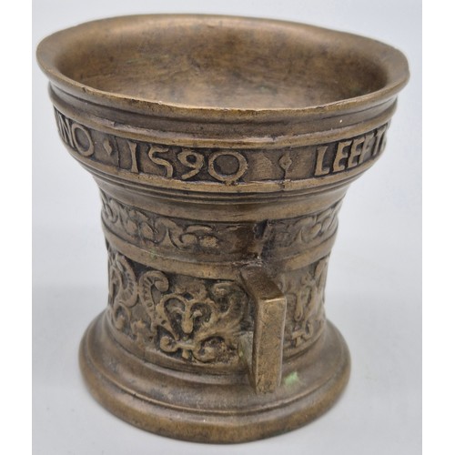 125 - Dutch Bronze two handle Mortar inscribed Leefte Verwint Al Dinck Anno 1590. [9.5cm high]