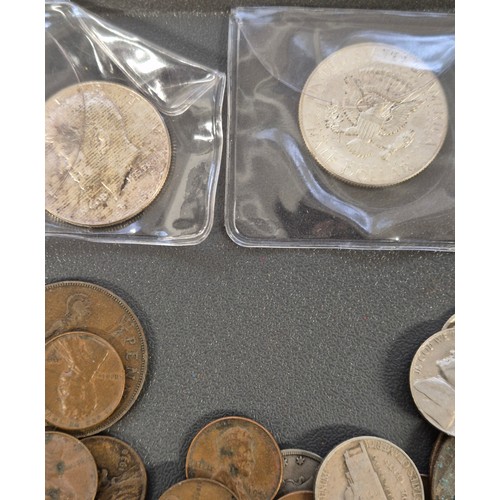 98 - A Tub of mixed world coins. Contains mostly American coins. Six J.F. Kennedy Half Dollar coins- 5x 1... 