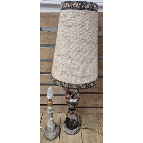 267 - Two various table lamps; heavy marble table lamp with shade and carved granite stone lighthouse shap... 