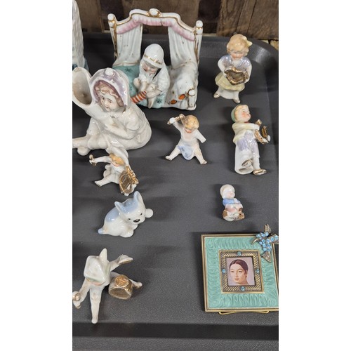 143 - Two Tray's of collectable figures and tile: Dickens series figures, Beswick dog, Wee Willie cat scul... 