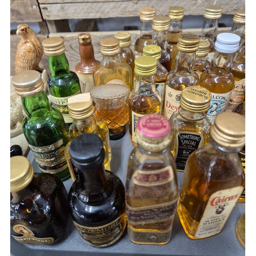 162 - A Tray containing a large quantity of mixed whisky miniatures; Johnnie Walker, Bell's, Hankey banist... 