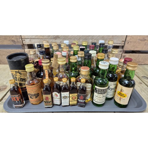 159 - A Tray containing a large quantity of vintage whisky miniatures; William Lawson's, Royal Troon, Old ... 