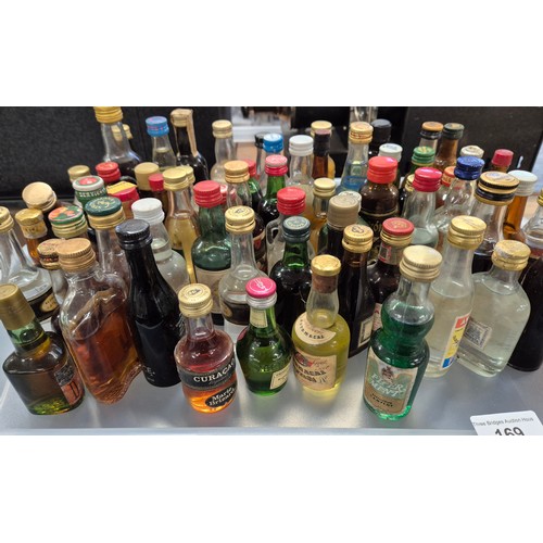 169 - Tray of mixed miniature spirits; Cavino, Marie Brizard and many more.