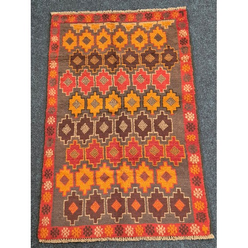 269 - Hand knotted Baluchi red ground rug. [123x86cm]