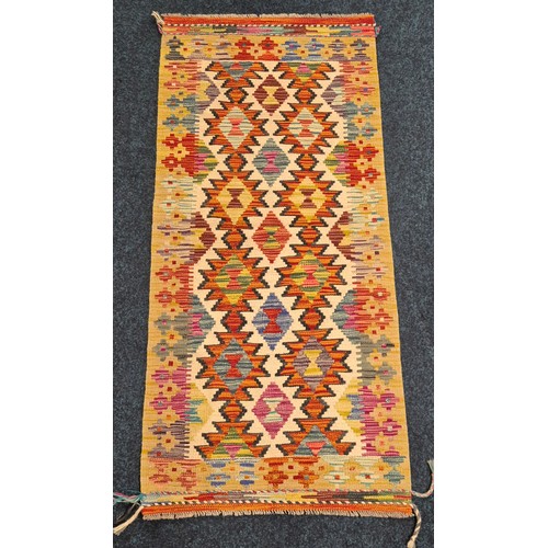 272 - Hand Knotted Chobi Kilim runner rug. Yellow ground. [150x66cm]