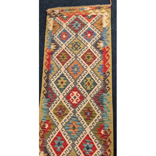 289 - Hand knotted Chobi Kilim runner rug. [254x85cm]