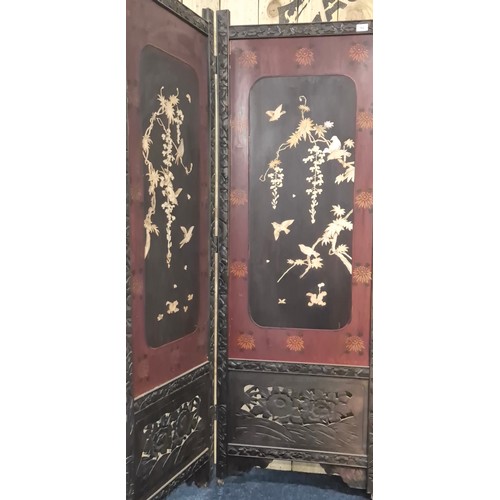 182 - A Large Japanese four fold room divider screen. Each panel being hand carved, lacquered and showing ... 