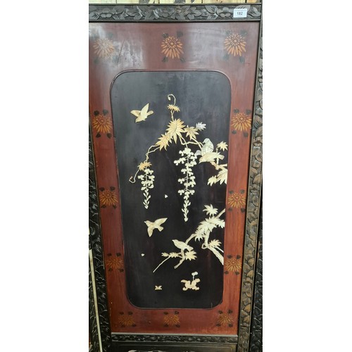 182 - A Large Japanese four fold room divider screen. Each panel being hand carved, lacquered and showing ... 