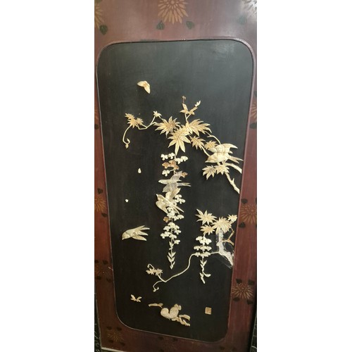 182 - A Large Japanese four fold room divider screen. Each panel being hand carved, lacquered and showing ... 