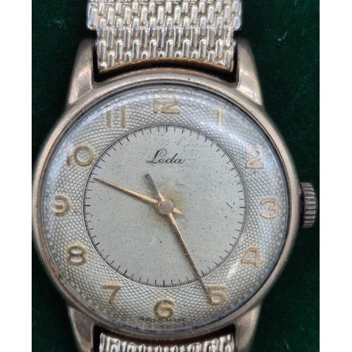 85 - A Vintage gent's 9ct yellow gold cased wristwatch produced by Leda. Fitted with a plated bracelet st... 