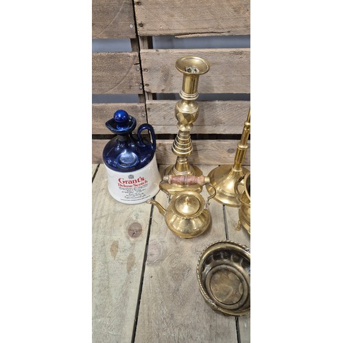 506 - A collection of brass ware & two Grants Deluxe scotch Decanters