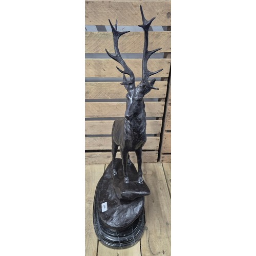 384 - After Jules Moigniez [1835-1984]
A Large reproduction patinated Bronze sculpture of a highland stag.... 