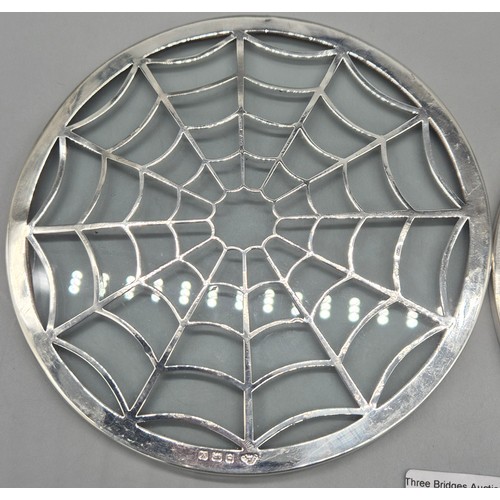 60 - Pair of Birmingham silver and glass resting trays. Produced by Adie Brothers. [15.5cm diameter]